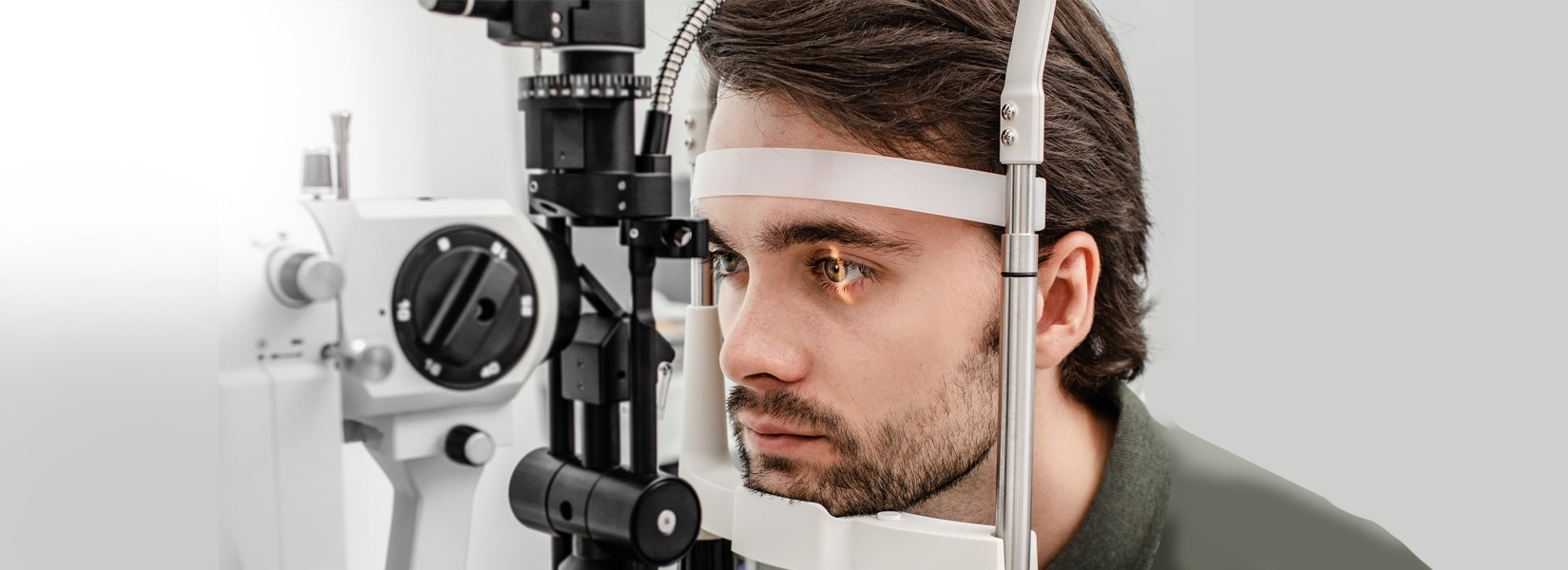 young man during eye exam in Pittsburgh
